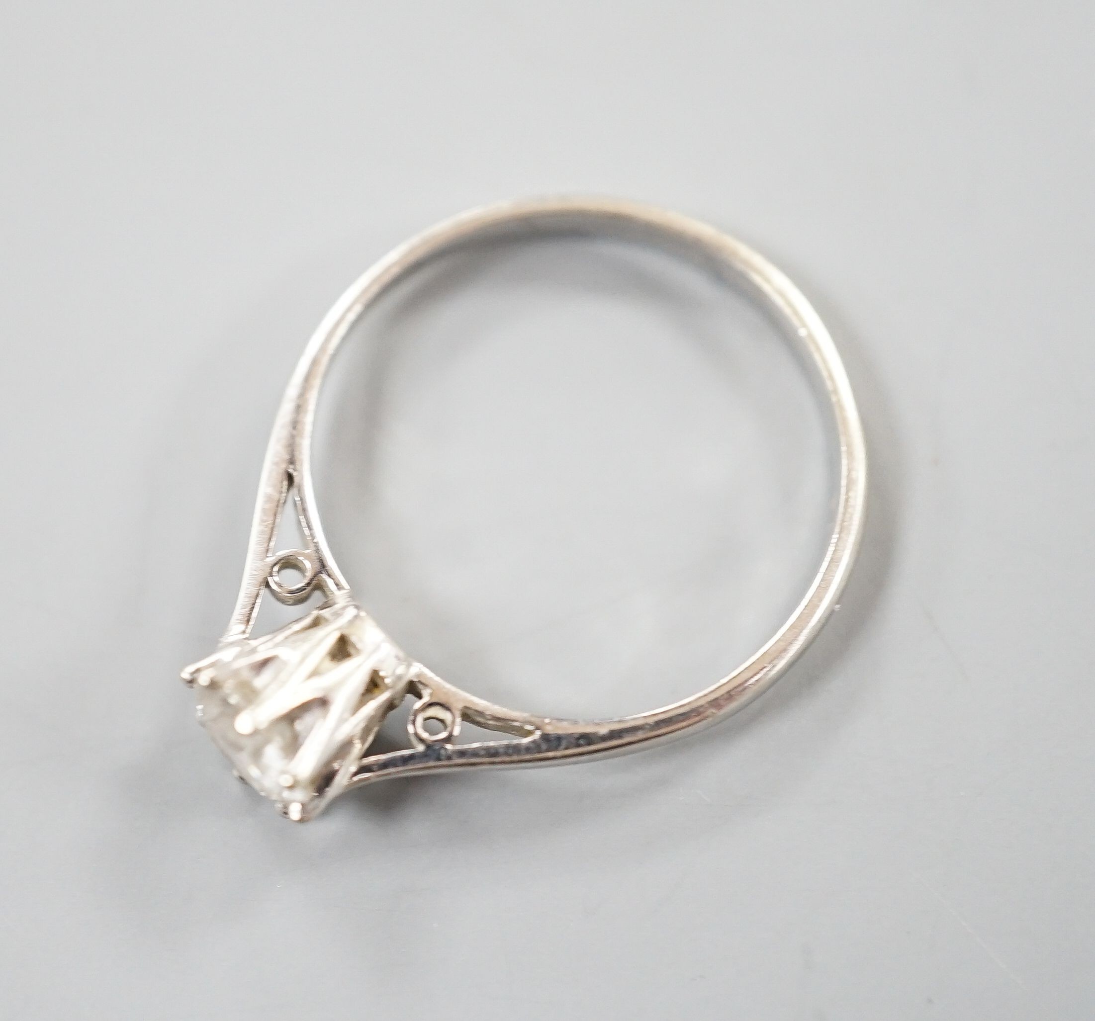 A modern 18ct white gold and solitaire diamond ring, size N, gross weight 2.2 grams, the stone measuring 5.2mm in diameter.